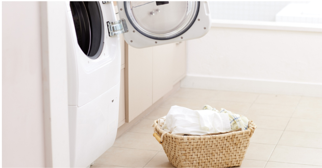 "A modern energy-saving washing machine with an Energy Star logo in a bright laundry room, representing energy efficiency and smart home appliances - Eco Power Guide.