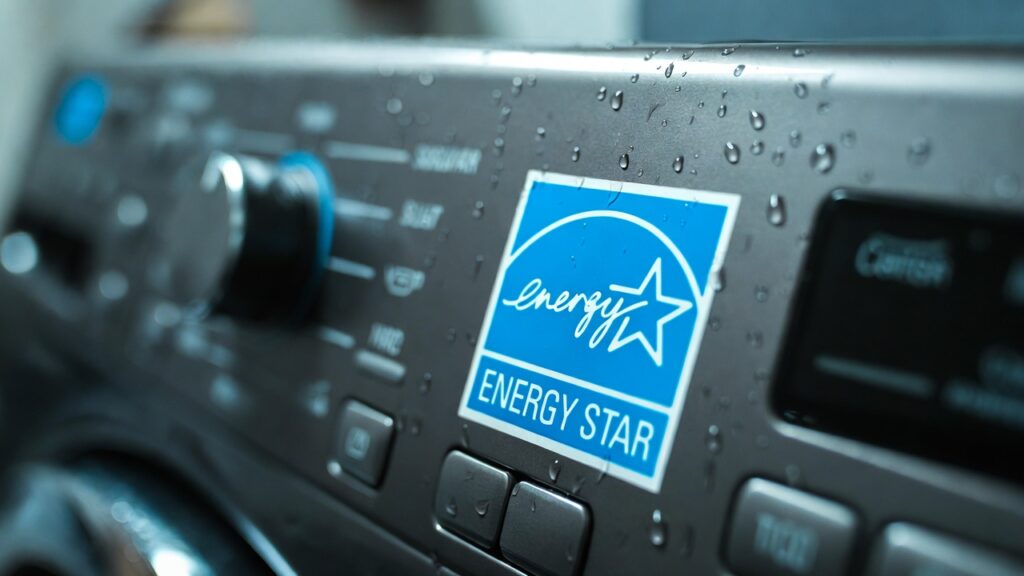 Modern washing machine control panel with a focus on the Energy Star certification sticker.